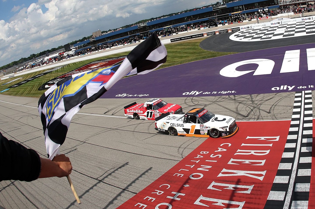 Corey Heim clinches thrilling Michigan NASCAR Truck Series victory in a photo‑finish.