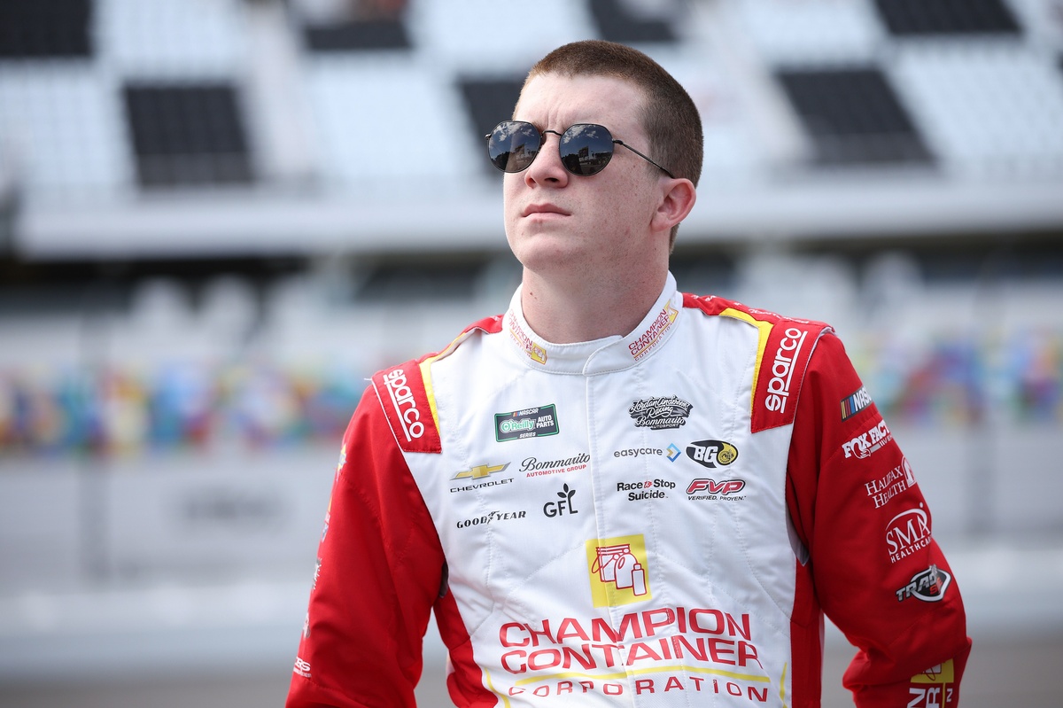 Daniel Dye surfs atop Kyle Larson’s car after last‑lap crash at Daytona.
